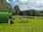 Drymen Camping: Green Pods with Standard Pitches in the distance