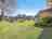 Barlings Beach Holiday Park: Villas and shared barbecue area 