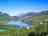 Camping La Genziana: Panorama of the village and the lake