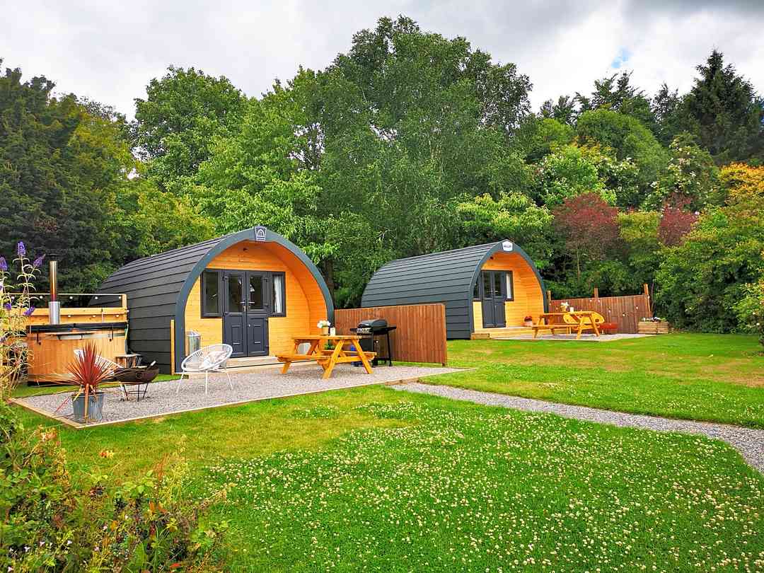 Hunts Court Huts: Robin on the left  and Jenny Wren on the right. Each pod has a private hot tub.