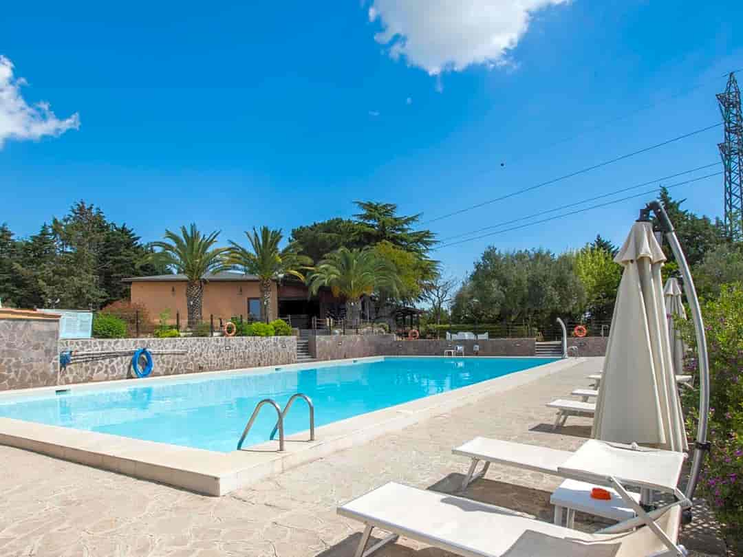 Happy Village: Swimming pool with sun loungers and umbrellas