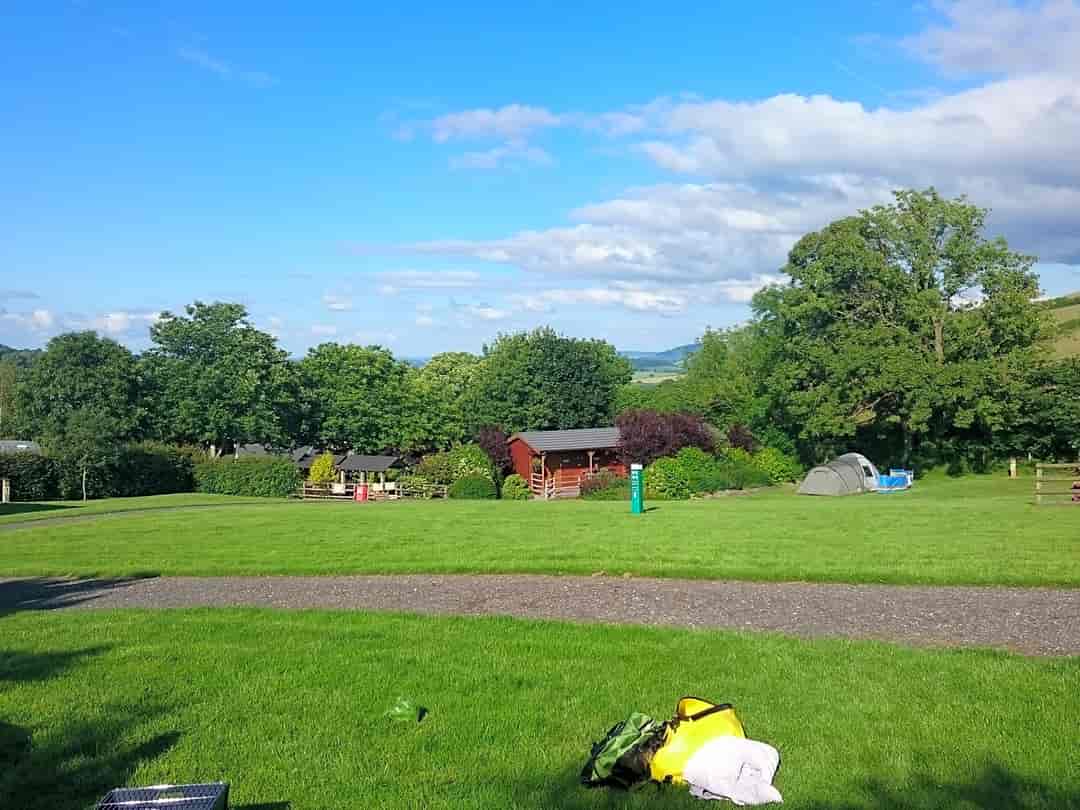Borders Hideaway Holiday Home Park: View from our pitch. Chalet type structure in centre is the toilet and shower block with dishwashing