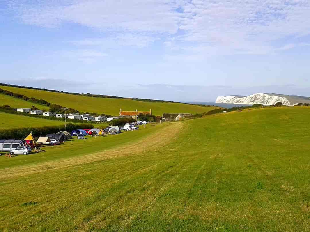 Compton Farm Caravan and Camping: Visitor image of the morning view with cliffs in the background