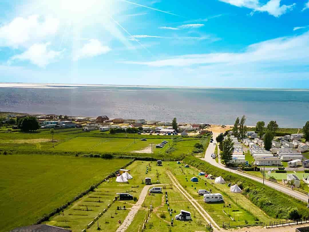 Hunstanton Camping and Glamping: Drone image of the campsite and the sea (photo added by manager on 21/01/2023)