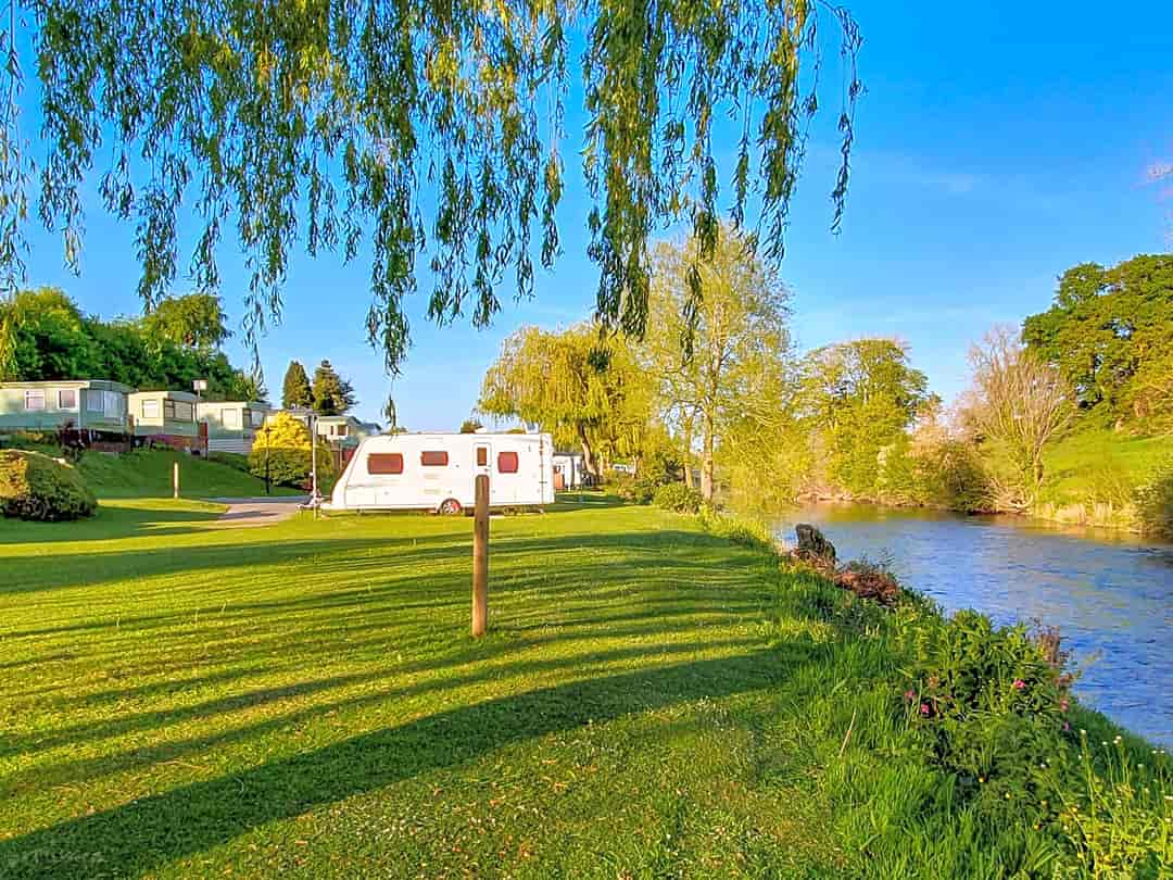 Argae Hall Caravan Park: Pitches by the river (photo added by manager on 21/09/2022)