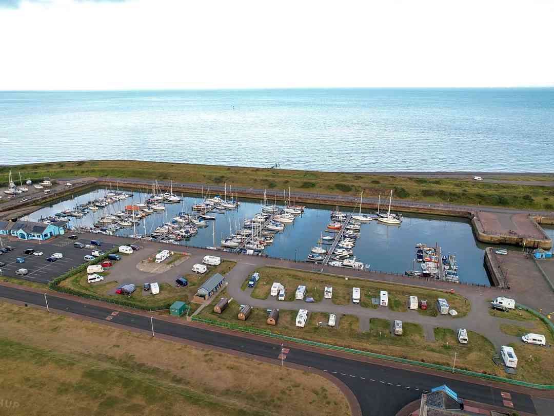 Harbour Side Caravan Site: View over the caravan site and marina (photo added by manager on 20/10/2023)