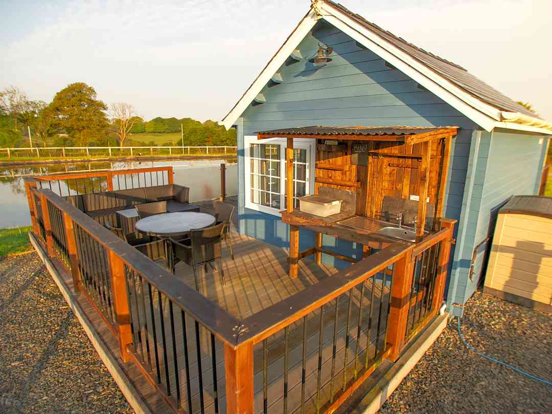 Deck with outdoor kitchen and seating