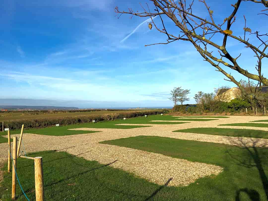 Long Meadow Farm: Gravelled pitches with grass