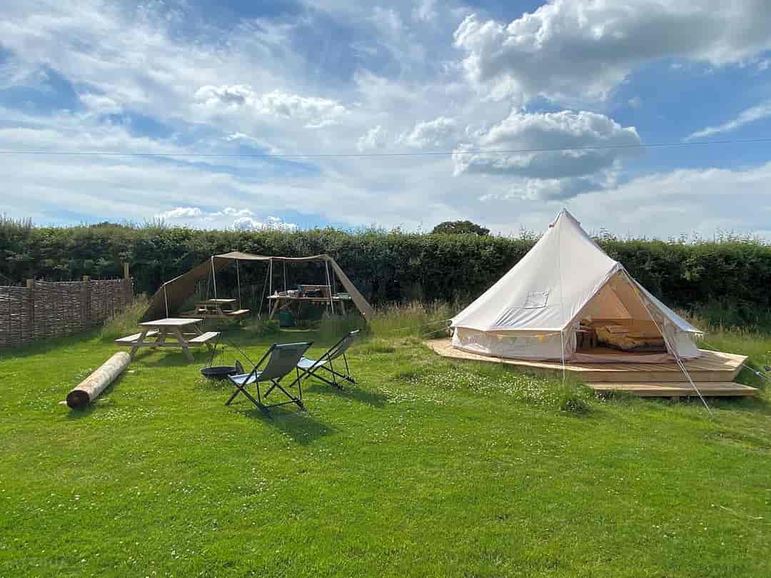 Glangwdi Glamping: Bluebell tent with its own seating area and kitchenette.