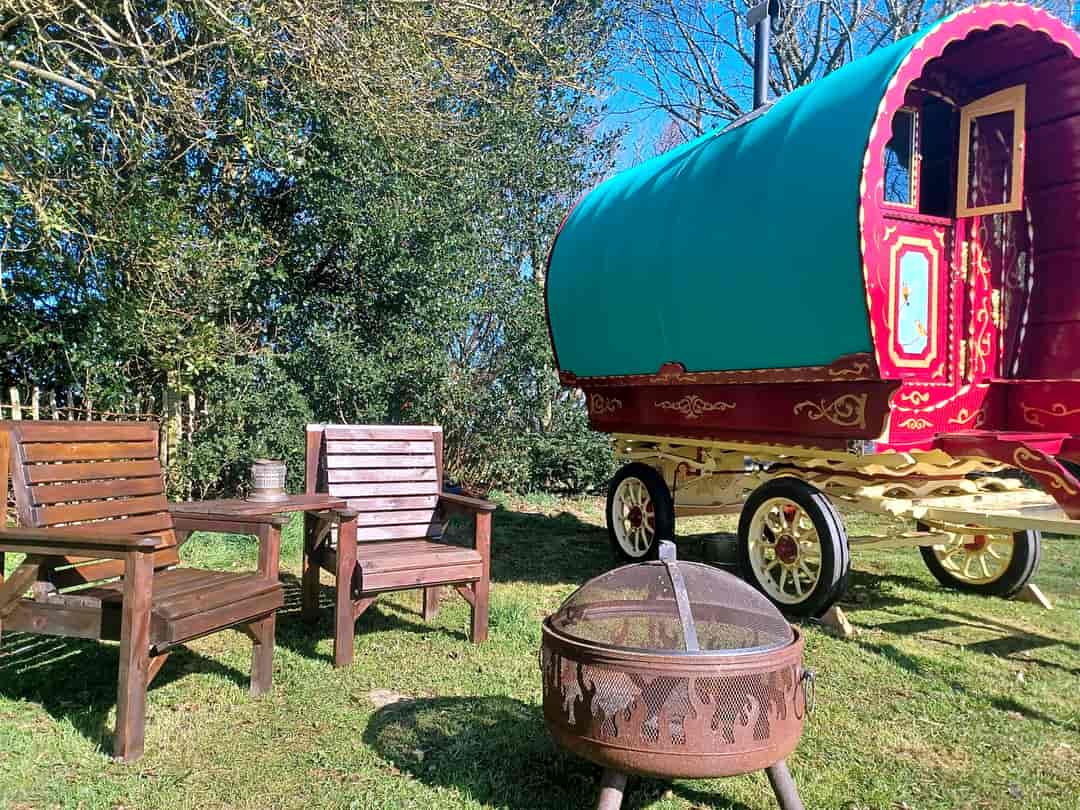 Logfire Holidays: Seating by the gypsy caravan