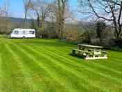 A spacious grass pitch for tents, motorhomes and campervans.