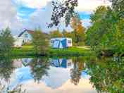 Visitor image of the view of the pitch from across the lake (added by manager 14 Sep 2022)