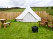 Bell tent surrounded by fencing