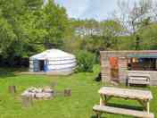 Sunshine yurt with kitchen dining area firepit and picnic table