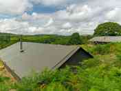 The view over the top of the tents to the valley beyond