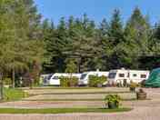 Fully-serviced gravel and hardstanding touring pitch