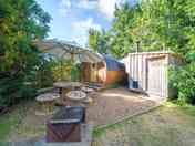 The Yellow Peewit sleeps 4 adults and 2 children, with a spacious outdoor dining and BBQ area.