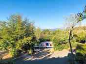 Sunny pitch with mountain views