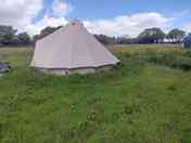 Most remote pitch only for tents, alongside woods in upper solar field