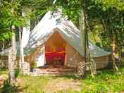 Tent entrance with afternoon sunshade curtains