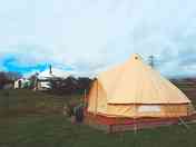 Robin Bell Tent outside early morning.