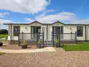 Lodge with parking, decking and private garden