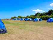 Our pre-erected tents give you space to park, bbq, kids to play and have a campfire