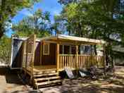 Caravan shaded by trees (added by manager 19 Mar 2024)