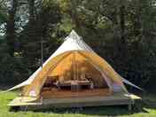 External view of bell tent on decking pad
