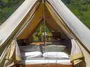 View of the sleeping area in the bell tent.