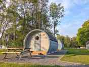 Cosy, weatherproof camping pods with outdoor seating