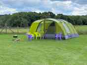 Pre-pitched tent with fire pit hire