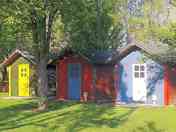 Brightly painted cabin exteriors