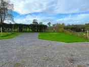 Electric hardstanding and grass touring pitch