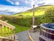 Enclosed private garden and wood fired hot tub with mountain views