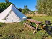 6 metre bell tent, sleeps up to 6 people. Barbecue, picnic bench and firepit included