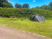 Picnic bench right next the the tent