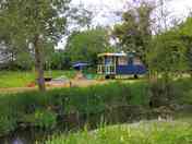 The blue gypsy caravan by the river