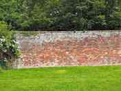 Non electric grass pitch suitable for tents only. Gently sloping.