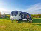 Caravan pitch with added awning