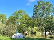 Quiet, no-electricity pitches located on the edge of the pond and other grassy area for vans.