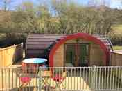 Exterior photo showing the hot tub and decking