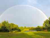 A rainbow appears across the park