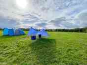 Tent and communal sheltered area