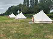 Unfurnished bell tents so guests can decorate