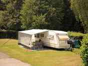 Our spacious pitches are separated by high hedges.