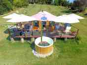 Shaded outdoor deck and hot tub