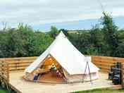 Bell tent on a wooden deck