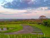 Grass pitches at the bottom and gravel to the right