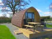 Rainbow View glamping pod with picnic table and deck chairs. (added by manager 02 Jun 2022)